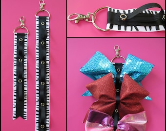 Cheer bow holder for backpacks and cheer bags, cheer bows, bow organizer, cheerleading bows, cheerleading accessories, cheer bow display
