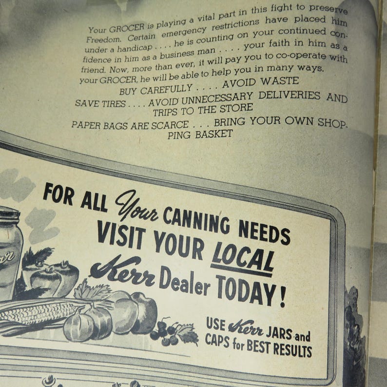 May include: Vintage advertisement for Kerr canning supplies. The ad features text promoting the brand and the phrase "Visit Your Local Kerr Dealer Today!" with illustrations of fruits and vegetables. The ad encourages the use of Kerr jars and caps.