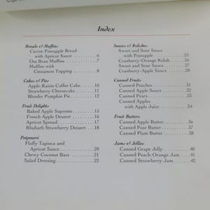 May include: A printed page titled "Index" with a list of recipes, including breads, muffins, cakes, pies, fruit delights, potpourri, sauces, relishes, canned fruits, fruit butters, and jams. The page is from a cookbook.