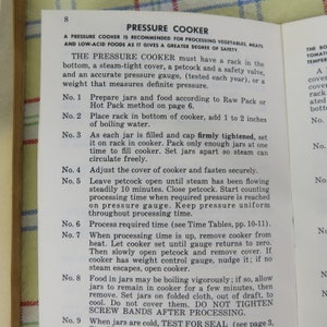 May include: Open book page with instructions for using a pressure cooker. The text is in black font on a white background. The title "PRESSURE COOKER" is at the top, followed by numbered steps for food preparation and canning.