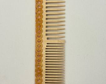 Wooden comb with birch bark lace.