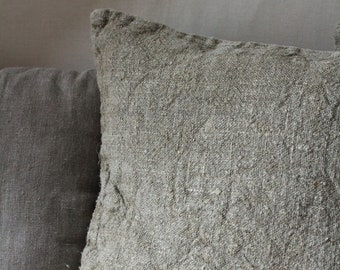 Raw rustic beige linen throw pillow made from undyed washed natural linen