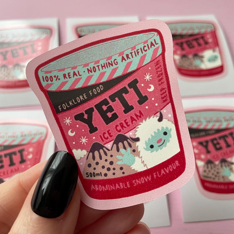 May include: Pink sticker with a cartoon illustration of a Yeti holding a cup of ice cream. The ice cream container is labeled "Yeti Ice Cream" and "Abominable Snow Flavor". The sticker is 500 ml.