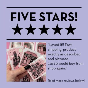 May include: Five stars rating with a customer review that reads "Loved it!! Fast shipping, product exactly as described and pictured. 10/10 would buy from shop again." The review is accompanied by a photo of a hand holding a set of pink and black stickers featuring a spooky, gothic-style house with a clock tower and the words "Magick Shoppe".