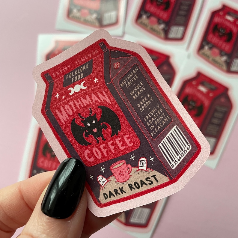 May include: A red and black coffee carton sticker with a mothman illustration and the text "Mothman Coffee" and "Dark Roast".