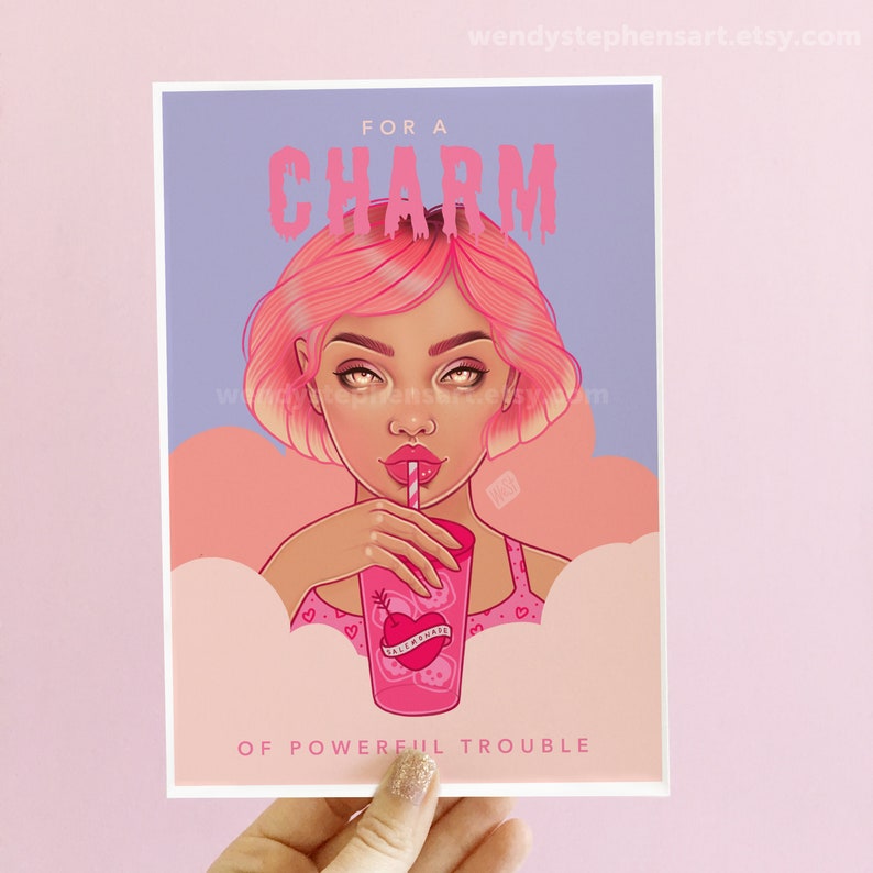 May include: Pink and purple illustration of a woman with pink hair drinking from a pink cup with a heart and arrow design. The text reads "For a Charm of Powerful Trouble".