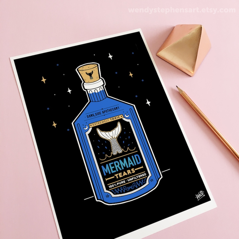 May include: A blue glass bottle with a cork stopper and a mermaid tail design. The label reads "Dark Side Apothecary - Extremely Toxic - Mermaid Tears - 100% Pure Unfiltered".