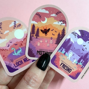 Cryptid Travel Poster Sticker Set, Mothman, Loch Ness, Fresno Nightcrawler, Spooky & Witchy sticker set, pink gothic stickers