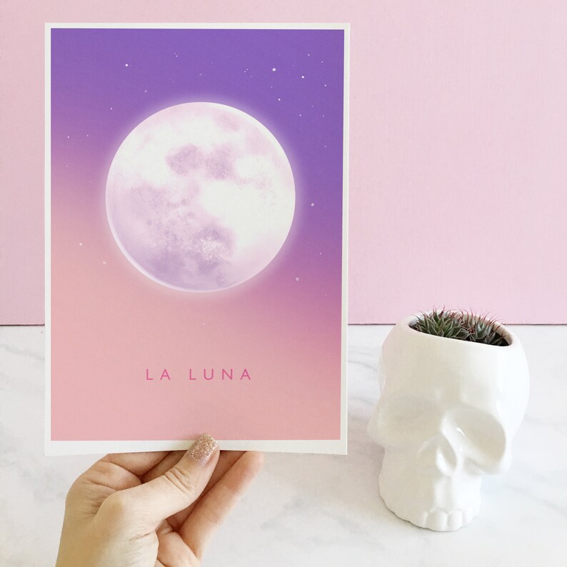 May include: A pink and purple gradient print with a large white moon and the text "LA LUNA" in pink.