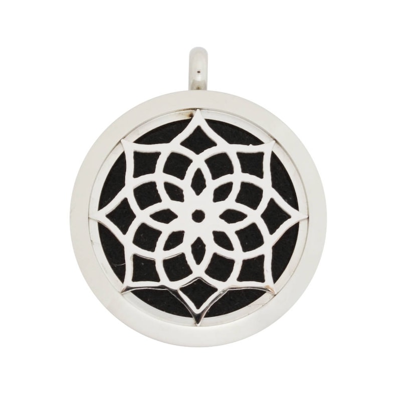 May include: Silver pendant with a black mandala design. The pendant is round and has a small loop at the top for attaching a chain.