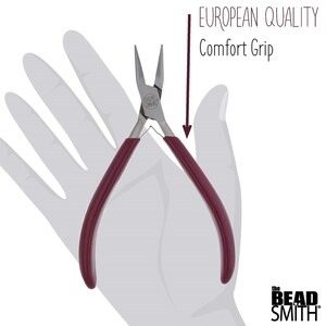 May include: Red handled pliers with a silver metal head. The pliers are labelled "CASUAL COMFORT". The text "EUROPEAN QUALITY Comfort Grip" is visible above the pliers. The text "the BEAD SMITH" is visible below the pliers.