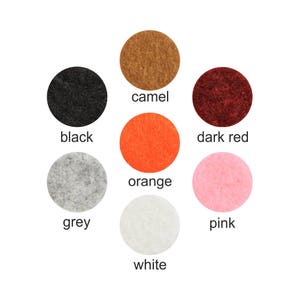May include: A set of ten color swatches in various shades of pink, orange, red, grey, white, black, camel, and dark red.