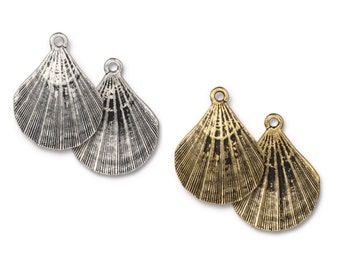 May include: Two pairs of antique silver and gold shell charms. Each charm is a detailed, textured, and slightly open shell.