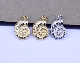 May include: Three nautilus shell charms, two gold and one silver, with a detailed spiral design. These charms are perfect for jewelry making or crafting.