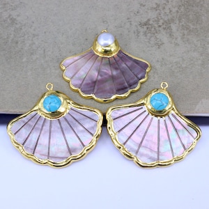 May include: Three fan-shaped pendants with gold-colored trim. Two pendants have a turquoise stone, and one has a pearl. The pendants have a mother-of-pearl effect with a radial design.
