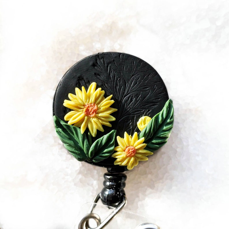 Yellow flowers badge reel