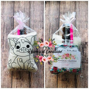 May include: A white pillow with a black outline of a cartoon pig. The pillow is packaged in a clear plastic bag with pink ribbon. The bag also contains markers for coloring the pig.