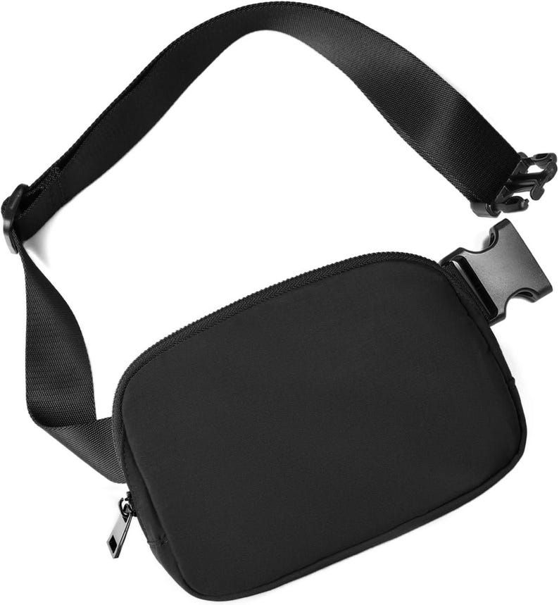 May include: A black fanny pack with a zippered main compartment and adjustable strap. The strap features a plastic buckle for secure closure. The bag is made of a smooth, matte material and is designed for hands-free carrying.