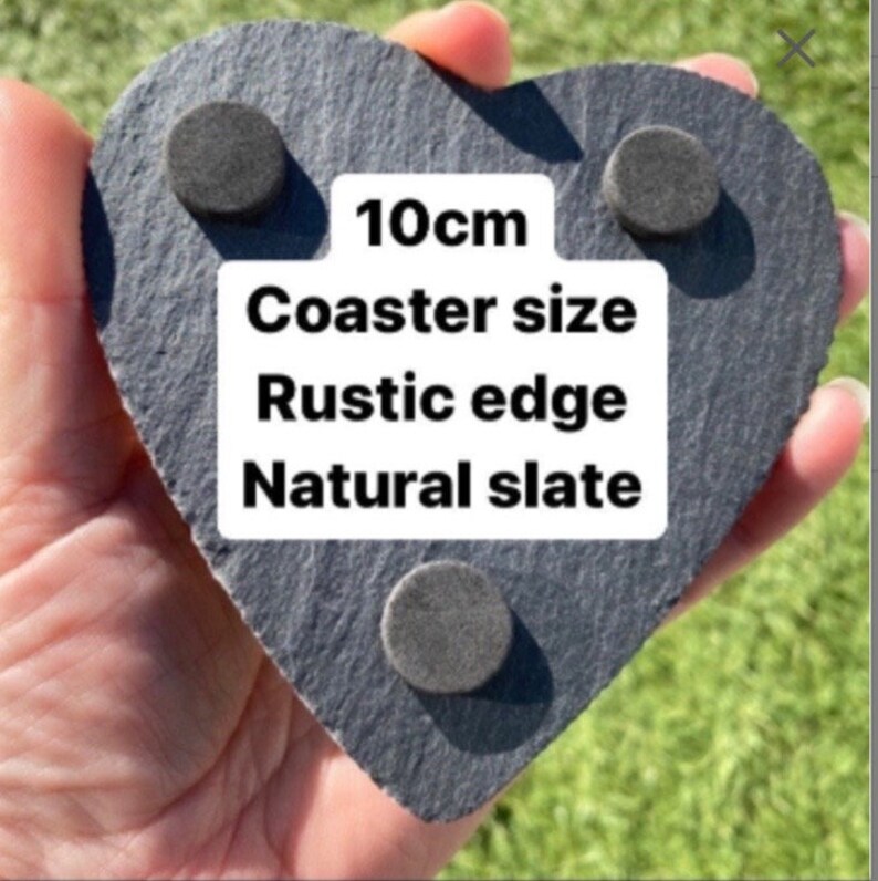 May include: A heart-shaped slate coaster with a rustic edge. The coaster is 10cm in diameter and has a natural slate finish. The coaster has three felt pads on the bottom to protect surfaces.