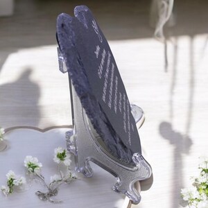 May include: A black slate heart-shaped plaque with a white inscription on a clear plastic stand. The inscription reads "You are my everything, my forever, my always".