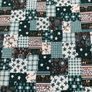 May include: A patchwork fabric with a variety of patterns in shades of green, brown, and white. The patterns include gingham, floral, and stars.
