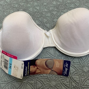 May include: White strapless bra with a satin finish. The bra has a tag that says "Illumination" strapless contour bra and "Vanity Fair".