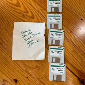 May include: Five floppy disks labeled "ClickArt EPS Animals & Nature" for Macintosh computers. A handwritten note reads "Original Click Art Animals/Nature Discs A,B,C,D,E"