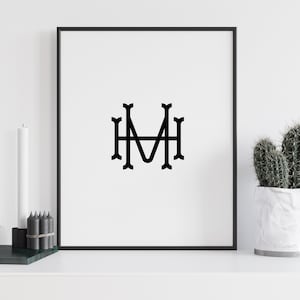 May include: Black and white monogram print of the letters "MH" in a decorative font, framed in a black frame.