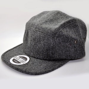 May include: A gray wool 5-panel cap with a black label that says "Black Label" and "Est. 2013".