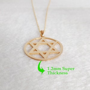 May include: A gold chain necklace with a pendant featuring a Star of David design. The pendant is 1.2mm thick.