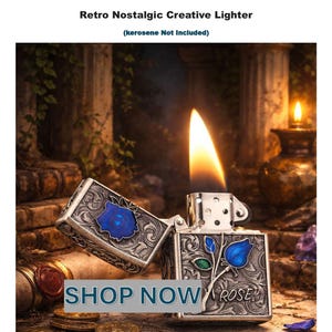 Op de afbeelding: Een vintage kerosineaansteker met een blauw rozenontwerp en het woord "ROSE" gegraveerd. De aansteker is open, met een vlam. De tekst "SHOP NOW" is ook zichtbaar.