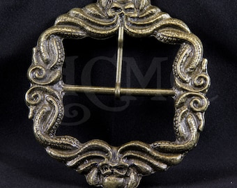 May include: A square brass oxide belt buckle featuring a relief design of octopus tentacles forming the frame, with a skull at the top and bottom center. The text Octopus and Brass Oxide is visible on the image along with a faint HCM watermark.