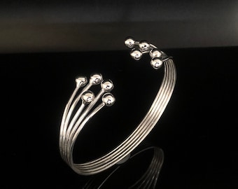 Orbiting Balls Sterling Silver Cuff Bracelet - High Polish