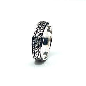 May include: A silver ring with a braided design. The band is wide and the braid is centered on the ring.