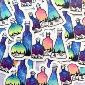May include: A set of colorful watercolor stickers featuring glass bottles with a variety of nature scenes inside. The bottles are filled with a starry night sky, a forest, and a mountain range. The stickers are perfect for adding a touch of whimsy to your journals, laptops, or water bottles.