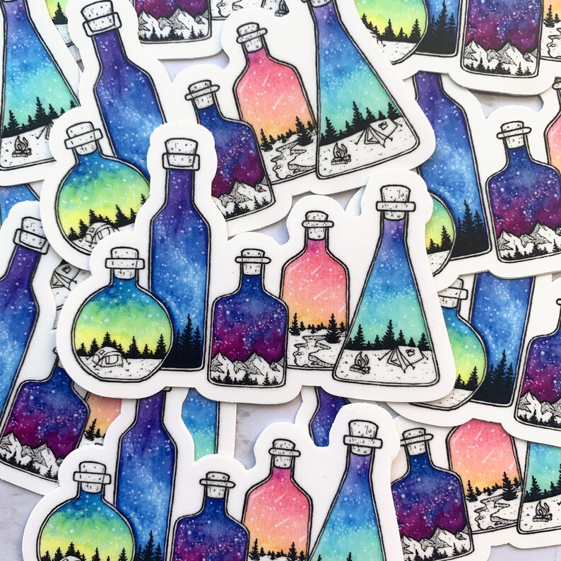 May include: A set of colorful watercolor stickers featuring glass bottles with a variety of nature scenes inside. The bottles are filled with a starry night sky, a forest, and a mountain range. The stickers are perfect for adding a touch of whimsy to your journals, laptops, or water bottles.