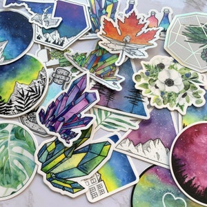 May include: A collection of colourful, hand-painted stickers featuring various designs, including crystals, flowers, mountains, and celestial scenes. The stickers are perfect for adding a touch of whimsy and personalisation to laptops, water bottles, journals, and more.