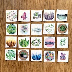 Könnte beinhalten: Set mit 20 Aquarell-Illustrationen mit verschiedenen Designs, die von der Natur inspiriert sind. Die Illustrationen umfassen Pflanzen, Blumen, Kristalle, Landschaften und geometrische Muster. Die Illustrationen sind in verschiedenen Farben gemalt, darunter Grün, Blau, Pink und Lila.