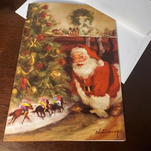 May include: A Christmas card featuring a painting of Santa Claus peeking around a decorated Christmas tree.  Four small toy horses with riders are in the foreground. The card is signed "elatesmanye".