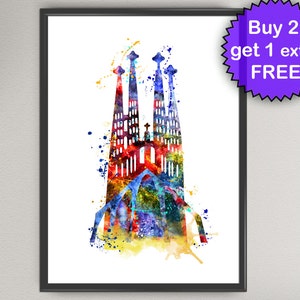 May include: A framed watercolor print of the Sagrada Familia in Barcelona. The artwork features a colorful, abstract depiction of the cathedral with splashes of red, blue, yellow, and green. A purple promotional sticker is in the upper right corner.