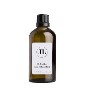 May include: A brown glass bottle with a black lid and a white label. The label has a black circle with the letters "JL" inside. The text on the label reads "Meditation Reed Diffuser Refill" and "www.lindsaylucascandles.co.uk".