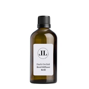 May include: A brown glass bottle with a black cap and a white label. The label has a black circle with the letters "JL" inside. The text on the label reads "Dark Orchid Reed Diffuser Refill".