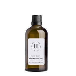 May include: A brown glass bottle with a black cap and a white label. The label has a black circle with the letters "JL" inside. The text on the label reads "Cola Cubes Reed Diffuser Refill" and "www.lindabaylucascandles.co.uk".