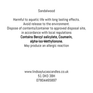 May include: White background with text about a product named Sandalwood. The text warns about potential environmental and health hazards, including allergic reactions. The text also includes a website, address, and phone number.