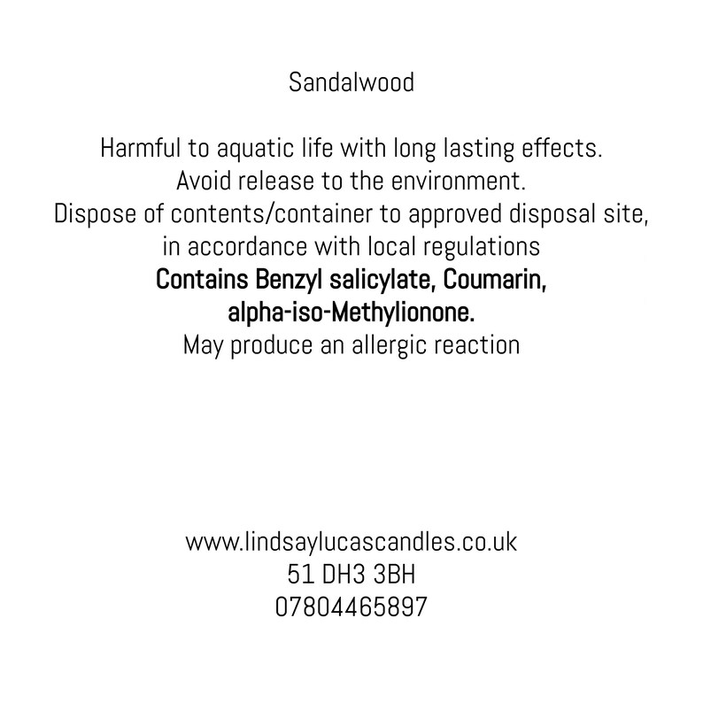 May include: White background with text about a product named Sandalwood. The text warns about potential environmental and health hazards, including allergic reactions. The text also includes a website, address, and phone number.