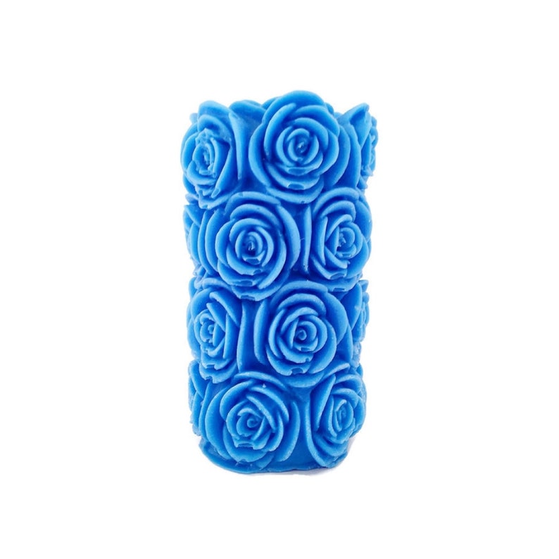 May include: A blue candle shaped like a bouquet of roses. The candle is made of wax and has a smooth, polished finish.