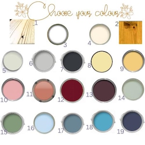 以下が含まれることがあります： Choose your colourというタイトルのカラーチャート。2種類の木目サンプルと、1から19まで番号が振られた17個の円形ペイント見本が並んでいます。パレットには、白、クリーム、黄色、ピンク、赤、紫、緑、そして様々な青の色合いが含まれています。