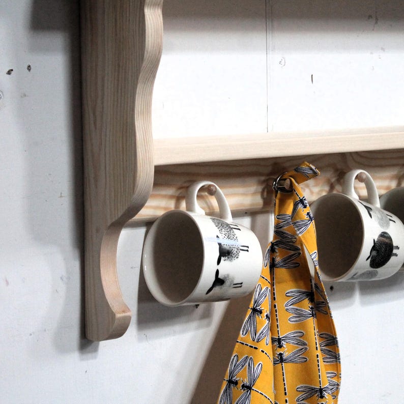 Deatil od natural wood shelf for mugs