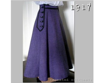 May include: A purple skirt with a black waistband and black buttons down the side. The skirt is full and flowing, and the fabric has a subtle texture. The text "1917" is visible in the upper right corner of the image.