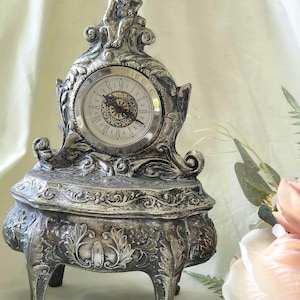 May include: A set of three ceramic mugs with a speckled, matte finish in cream, light grey, and dark grey. Each mug has a simple, minimalist design, suitable for coffee or tea.